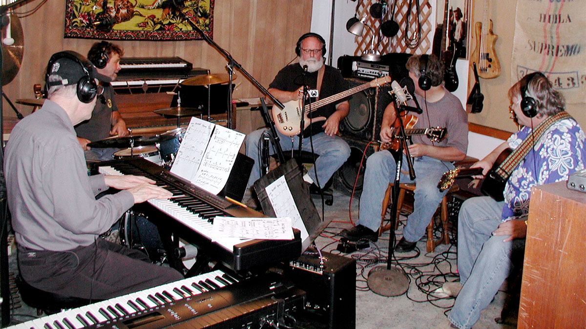 Group of musicians recording in a studio